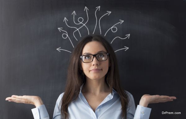 Businesswoman on blackboard and many twisted arrows in her head