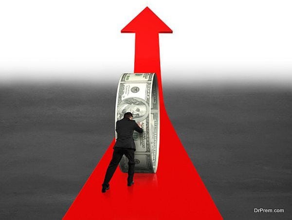 Businessman pushing money circle on growing red arrow